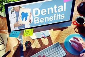A computer with the words Dental Benefits on the screen